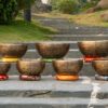 Bát hát Tây Tạng trên thảm cỏ xanh mát. Bộ 7 Chuông Full Moon Hệ Vedic 17-28cm – By Santa Ratna Shakya